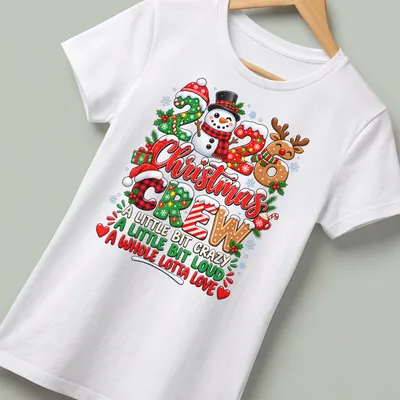 Colorful festive Christmas shirt with snowman and reindeer illustrations — printed on a women's shirt