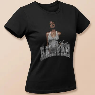 Illustrative tribute to Aaliyah with her name in a flowing sketch style — printed on a women's shirt