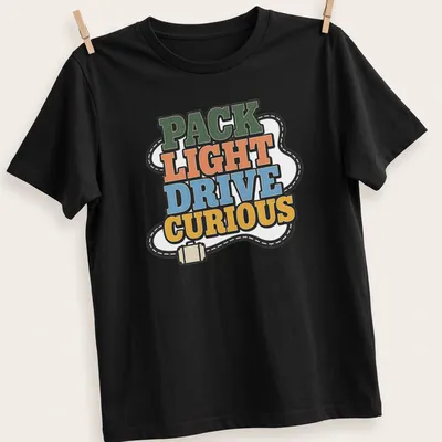 Bold retro Pack Light Drive Curious T-shirt with adventure theme in vibrant colors
