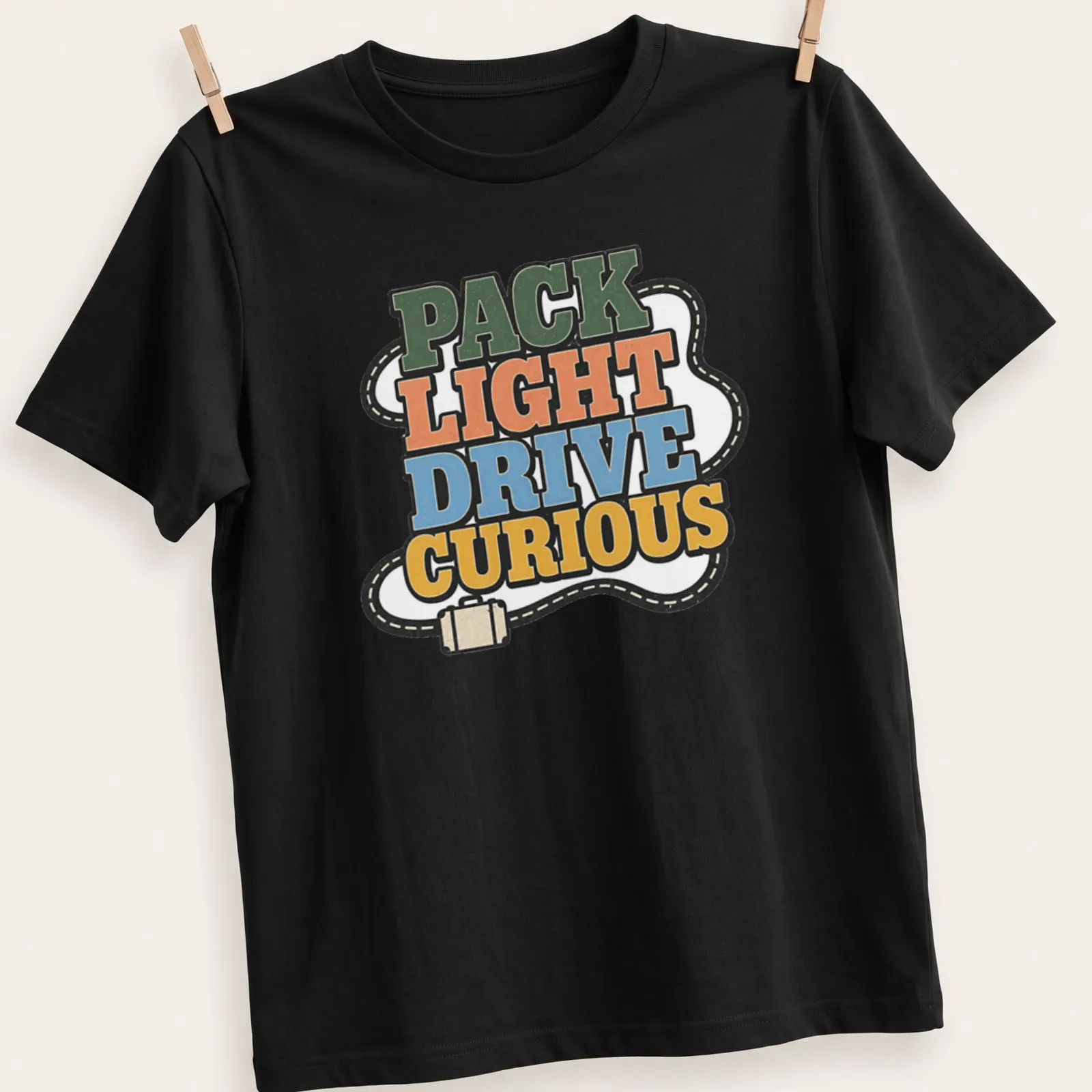 Bold retro Pack Light Drive Curious T-shirt with adventure theme in vibrant colors — printed on a unisex t-shirt