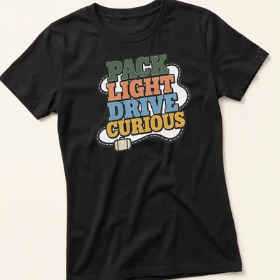Bold retro Pack Light Drive Curious T-shirt with adventure theme in vibrant colors — printed on a women's shirt