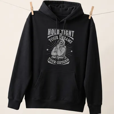 Skeleton astronaut graphic with text about dreams and oxygen in vintage style — printed on a unisex hoodie