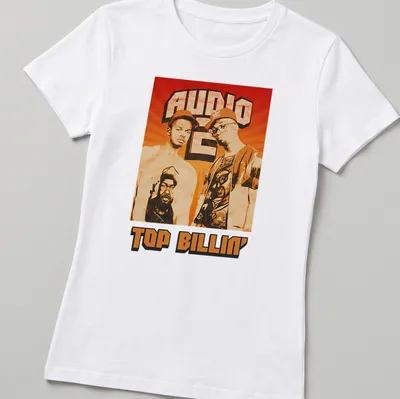 Retro distressed Audio Two Top Billin' T-shirt featuring two men in orange, brown, black, and white — printed on a women's shirt