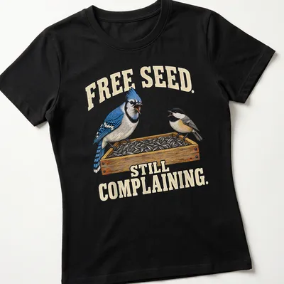 Illustration of a Blue Jay with humorous text about free seeds — printed on a women's shirt