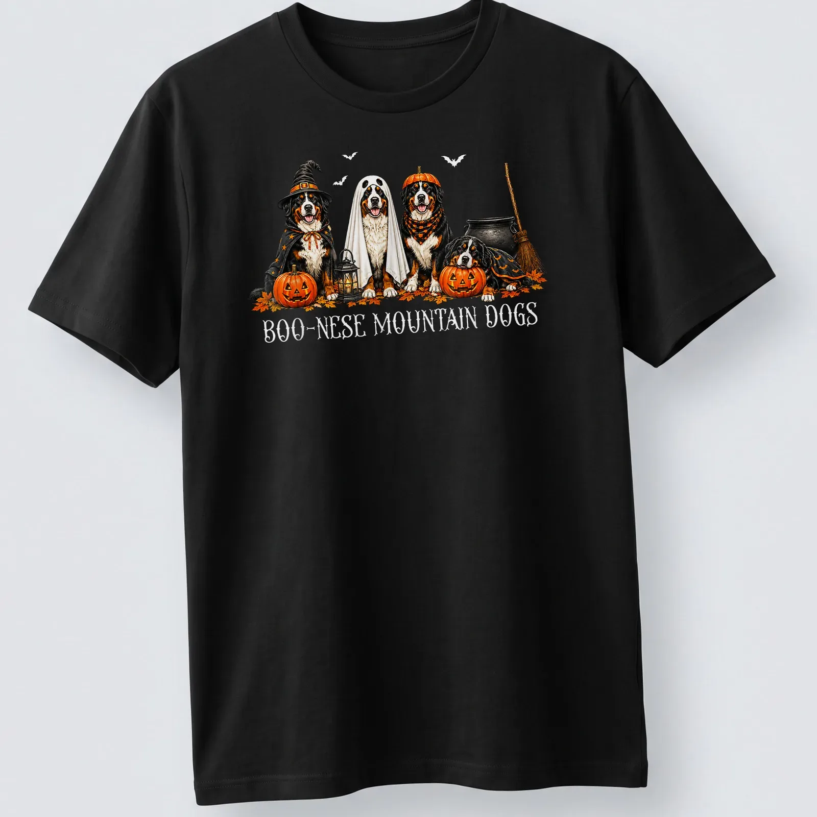 Illustrative Halloween scene featuring Boo Nese Mountain Dogs in witch costumes with pumpkins — printed on a unisex t-shirt