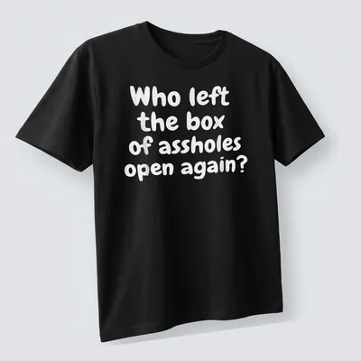 Funny T-shirt with text asking who left the box of assholes open again, against a white background. — printed on a unisex t-shirt (angled view)