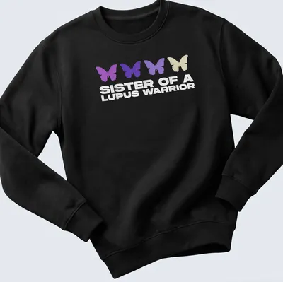 Stylish T-shirt featuring butterflies and the phrase 'Sister of a Lupus Warrior' in modern typography. — printed on a unisex sweatshirt