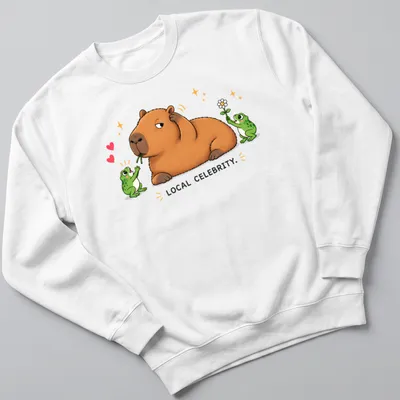 Kawaii style capybara surrounded by frog fans with text 'LOCAL CELEBRITY.' — printed on a unisex sweatshirt