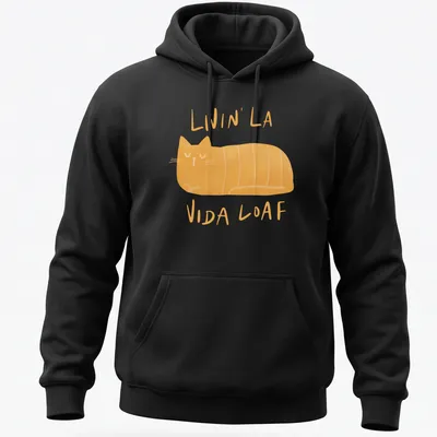 Kawaii illustration of a loafing cat with text 'Livin' La Vida Loaf' in orange and cream. — printed on a unisex hoodie