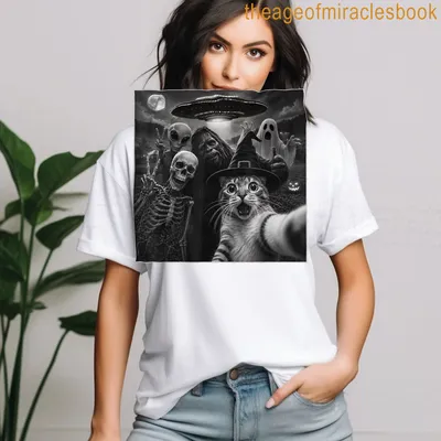 Humorous cat selfie with Bigfoot, skeleton, alien, and ghost graphic. — printed on a women's t-shirt