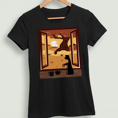 Black cat watching an autumn sunset through a window beside coffee — printed on a women's shirt