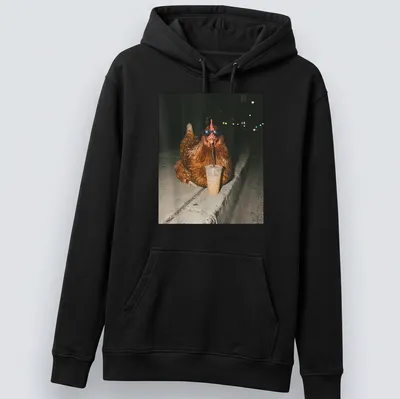 A whimsical chicken sipping iced coffee, rendered in a photographic style. — printed on a unisex hoodie