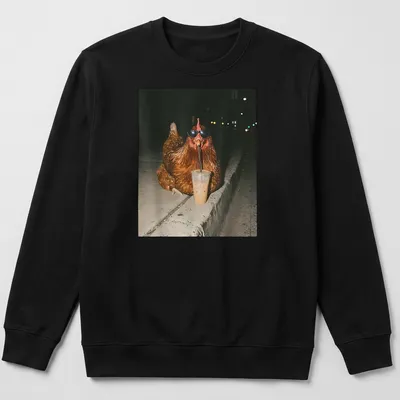 A whimsical chicken sipping iced coffee, rendered in a photographic style. — printed on a unisex sweatshirt