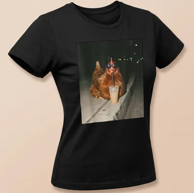 A whimsical chicken sipping iced coffee, rendered in a photographic style. — printed on a women's shirt