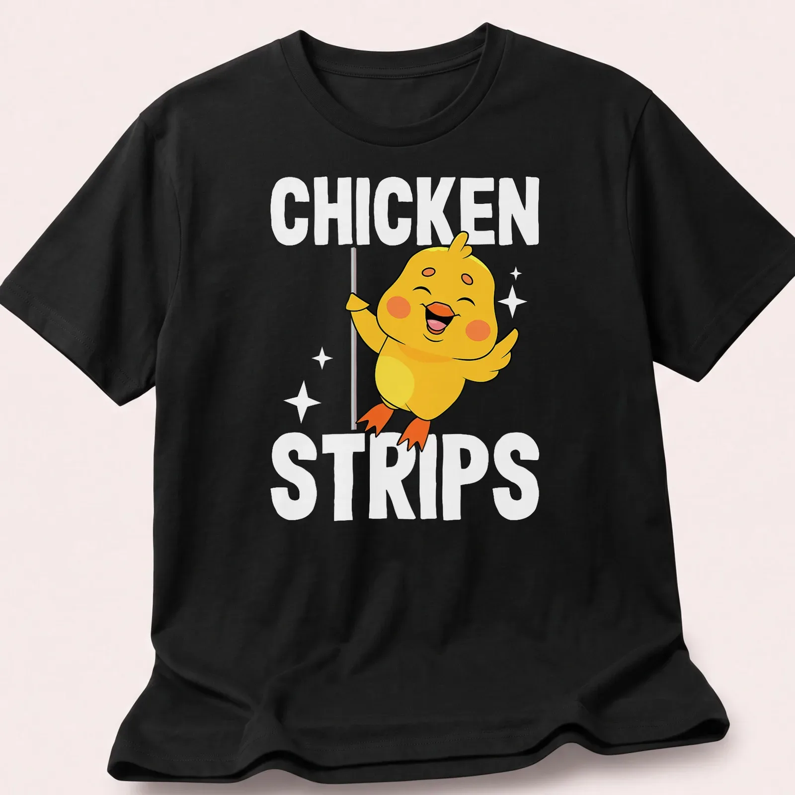 Cartoon of a cute yellow chicken dancing with the text 'CHICKEN STRIPS' in playful lettering. — printed on a unisex t-shirt
