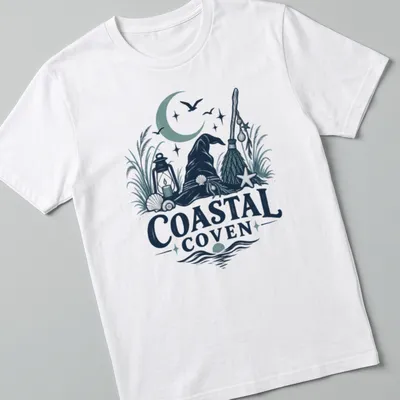 Vintage illustrated Coastal Coven t-shirt with witch hat and coastal motifs