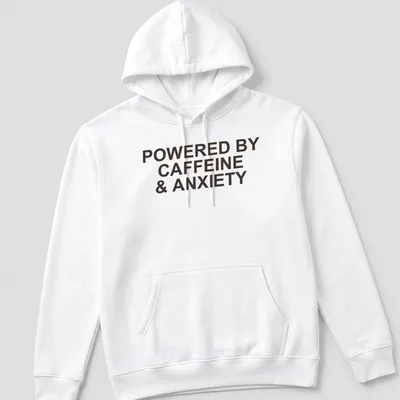 Bold typography t-shirt with the phrase 'Powered By Caffeine & Anxiety' in brown — printed on a unisex hoodie