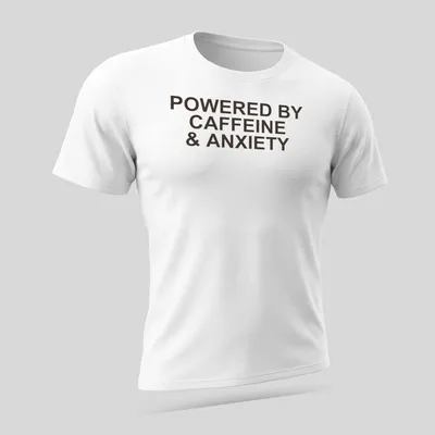 Bold typography t-shirt with the phrase 'Powered By Caffeine & Anxiety' in brown — printed on a unisex t-shirt (angled view)