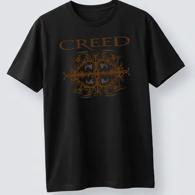 Ornate printed design of the Creed band logo in brown and white