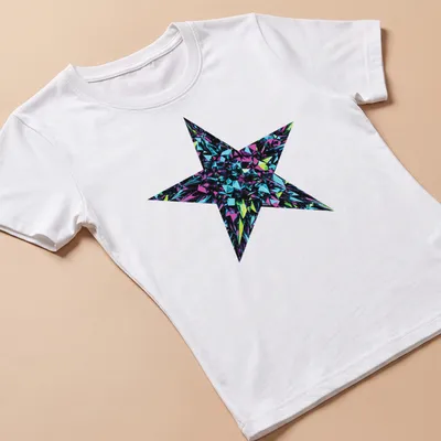 3D art of a crystal star burst in metallic blue, purple, green, and black — printed on a women's shirt
