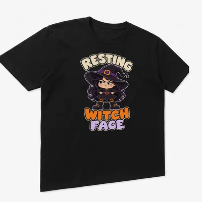 Kawaii grumpy witch illustration with Resting Witch Face text in purple, black, orange, and beige — printed on a unisex t-shirt (angled view)