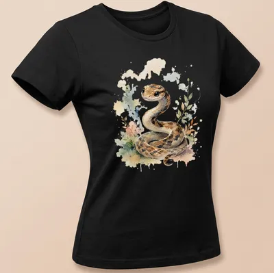 Watercolor illustration of a cute snake in brown, cream, green, pink, and blue. — printed on a women's shirt
