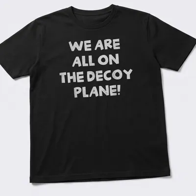 Bold typography t-shirt with the phrase 'We Are All On The Decoy Plane!' and a decoy plane graphic.