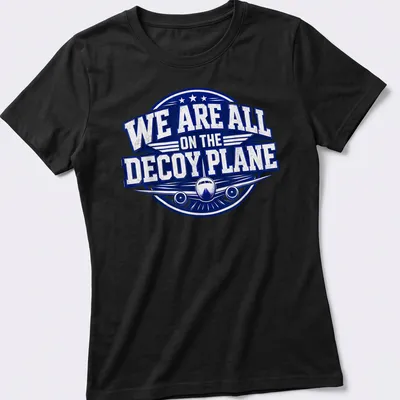 Bold vintage print of a decoy plane with text reading 'We Are All On The Decoy Plane' — printed on a women's shirt