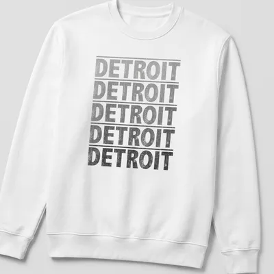 Distressed Detroit text graphic tee in gray, black, and white — printed on a unisex sweatshirt