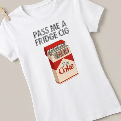 Humorous meme shirt featuring Diet Coke cans and the phrase 'Pass Me A Fridge Cig.' — printed on a women's shirt