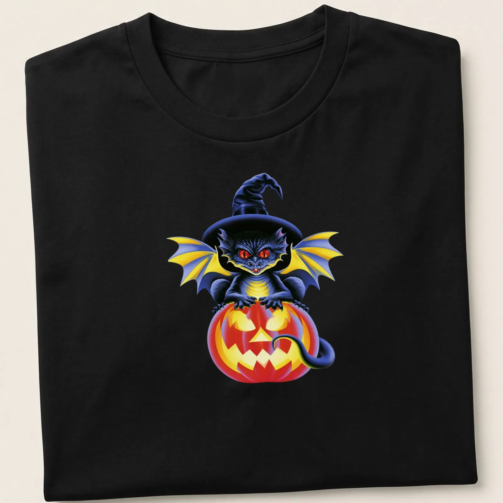 Colorful cartoon dragon sitting on a pumpkin, celebrating Halloween — printed on a unisex t-shirt