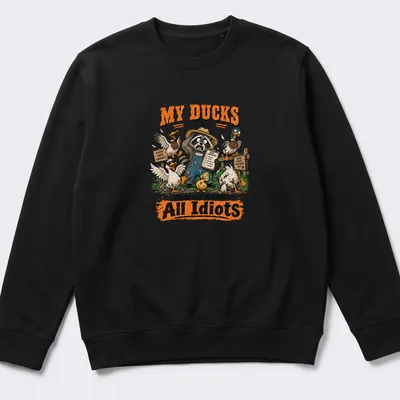 Cartoon illustration of a raccoon with ducks, humorously expressing chaos. — printed on a unisex sweatshirt