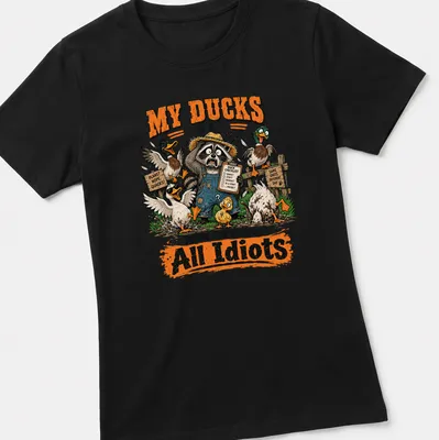 Cartoon illustration of a raccoon with ducks, humorously expressing chaos. — printed on a women's shirt