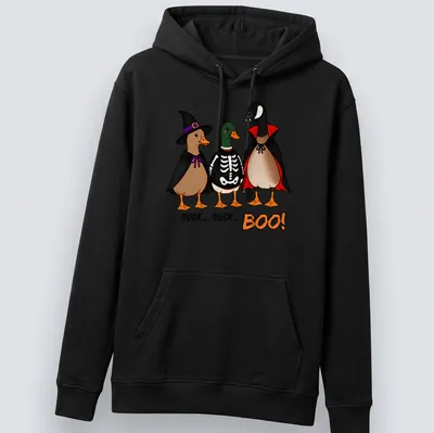 Cartoon ducks in costumes with the text Duck Duck Boo! in vibrant colors. — printed on a unisex hoodie