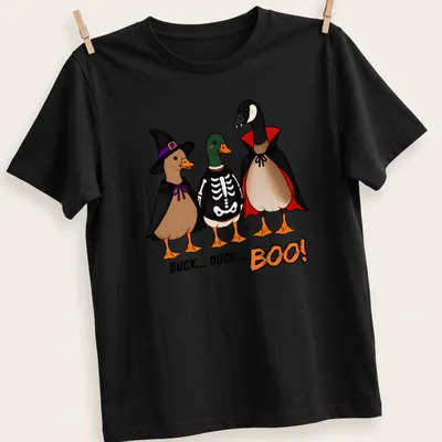 Cartoon ducks in costumes with the text Duck Duck Boo! in vibrant colors.