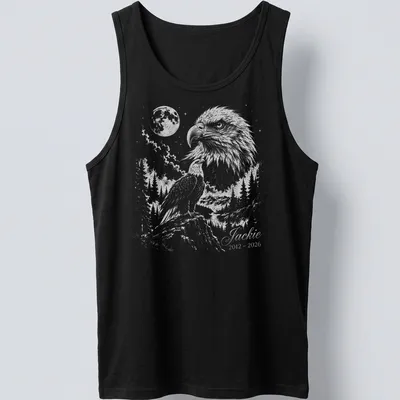 Detailed illustration of an eagle in flight with memorial text below. — printed on a tank top