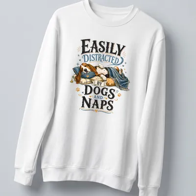 Whimsical illustration of a sleeping beagle with the text 'Easily Distracted By Dogs And Naps' — printed on a unisex sweatshirt