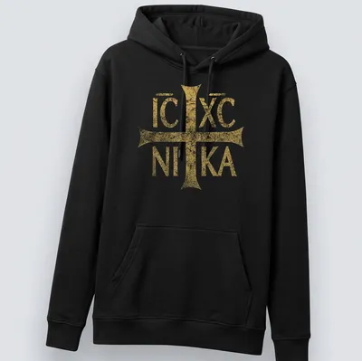Distressed vintage t-shirt featuring the Eastern Orthodox Christian symbol IC XC NIKA in gold — printed on a unisex hoodie