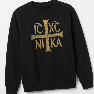 Distressed vintage t-shirt featuring the Eastern Orthodox Christian symbol IC XC NIKA in gold — printed on a unisex sweatshirt