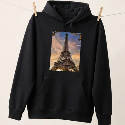 Photographic print of the Eiffel Tower in golden, blue, pink, and orange hues — printed on a unisex hoodie