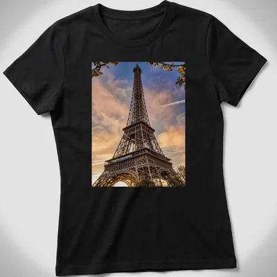 Photographic print of the Eiffel Tower in golden, blue, pink, and orange hues — printed on a women's shirt