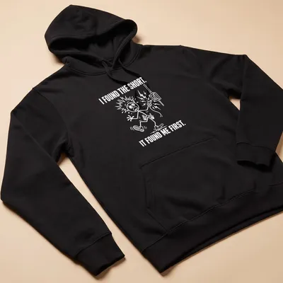 Electrician humor t-shirt with cartoon illustration and bold text on white background — printed on a unisex hoodie