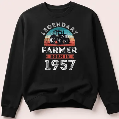 Retro distressed t-shirt with tractor and text for a legendary farmer born in 1957 — printed on a unisex sweatshirt