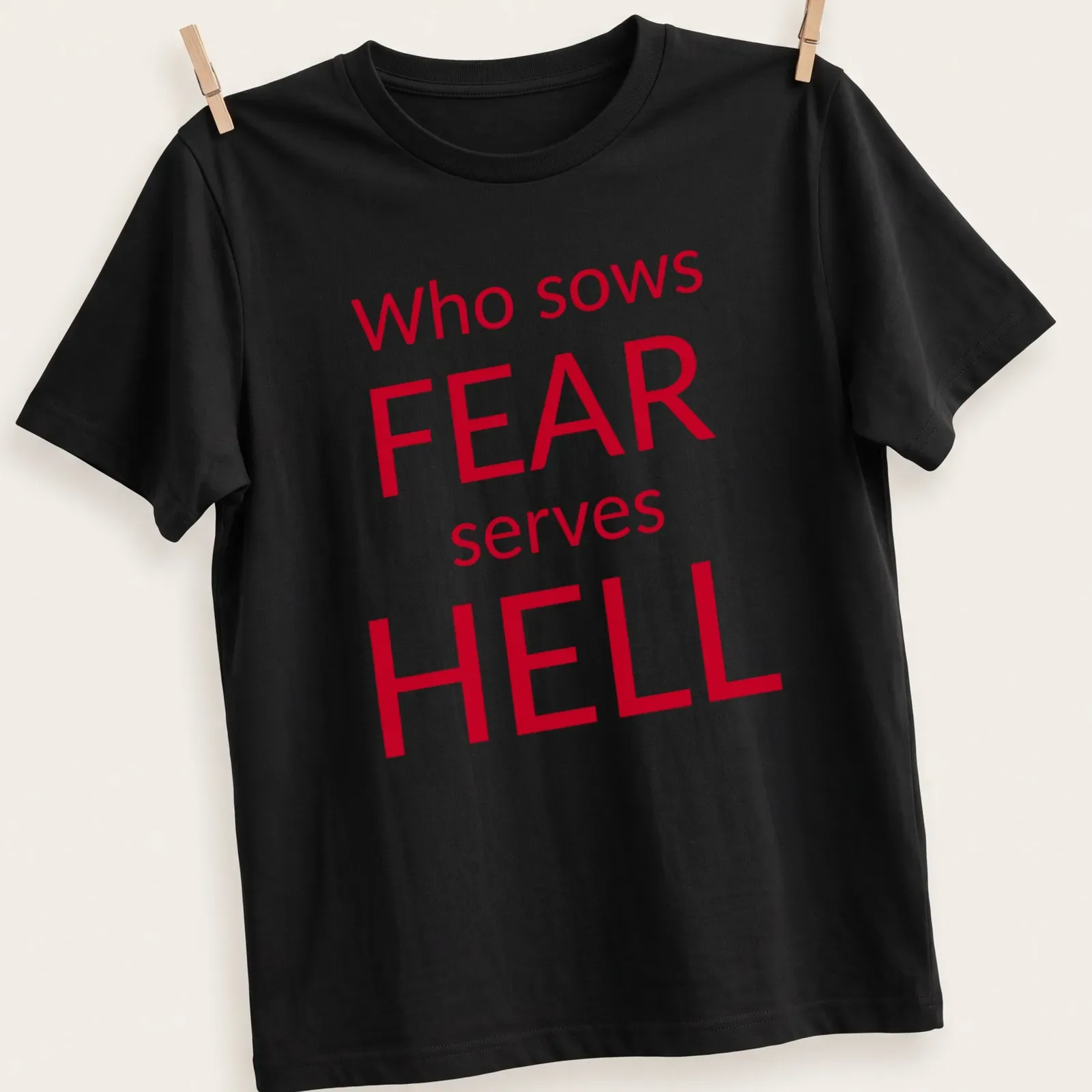 Bold typography t-shirt featuring the phrase about fear in red and white — printed on a unisex t-shirt