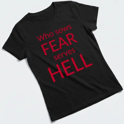 Bold typography t-shirt featuring the phrase about fear in red and white — printed on a women's shirt