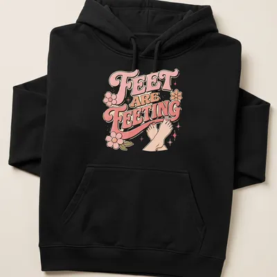 Playful retro Feet Are Feeting t-shirt with colorful lettering and feet illustration — printed on a unisex hoodie
