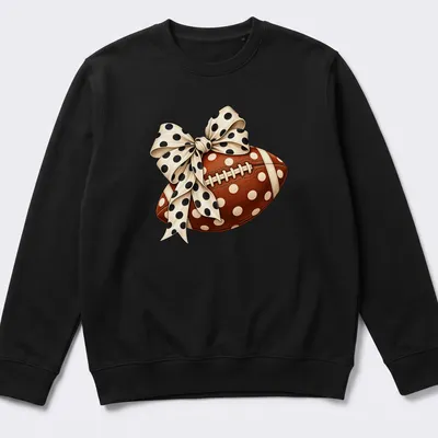 Realistic football with a polka dot bow graphic in brown and cream — printed on a unisex sweatshirt