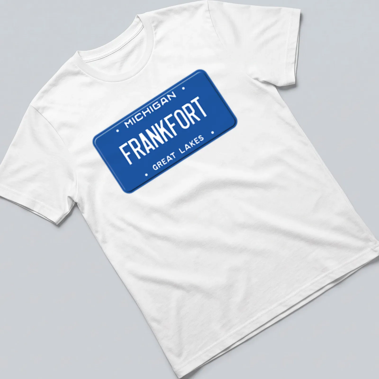 Vintage graphic t-shirt featuring a Michigan license plate design in blue and white. — printed on a unisex t-shirt