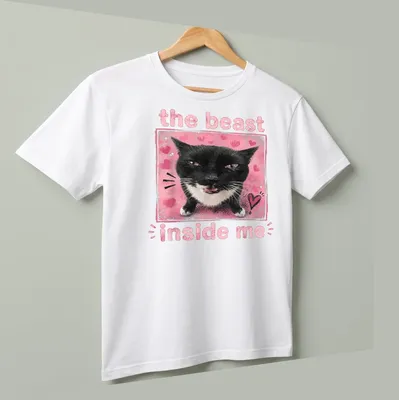 Illustration of a black and white cat with text 'the beast inside me' in playful font. — angled view