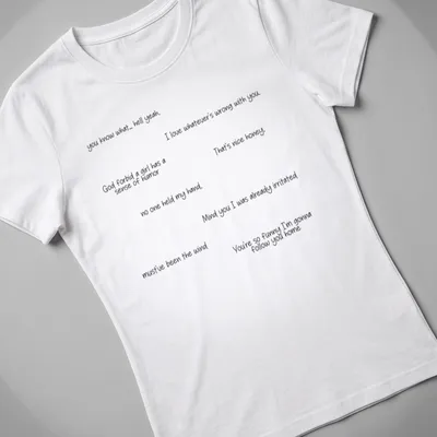 Handwritten humorous comments printed in black on a white — printed on a women's shirt